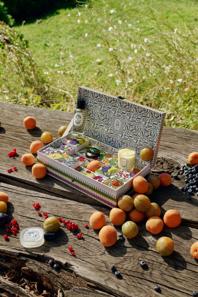 Box of beauty products with oranges