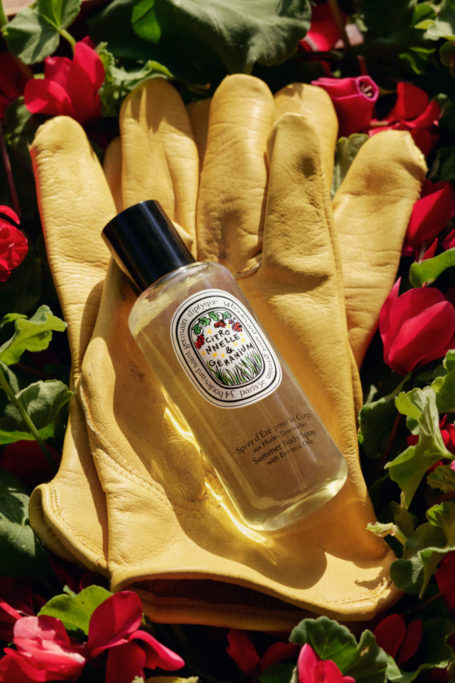 Body spray set on yellow gardening gloves
