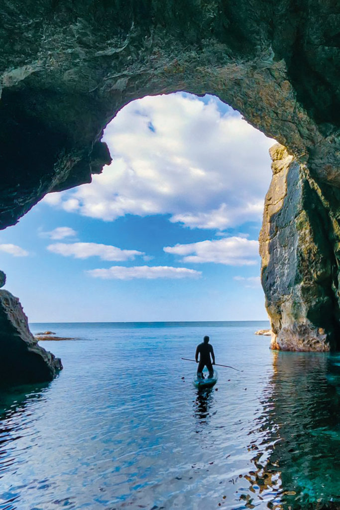 A person paddleboarding