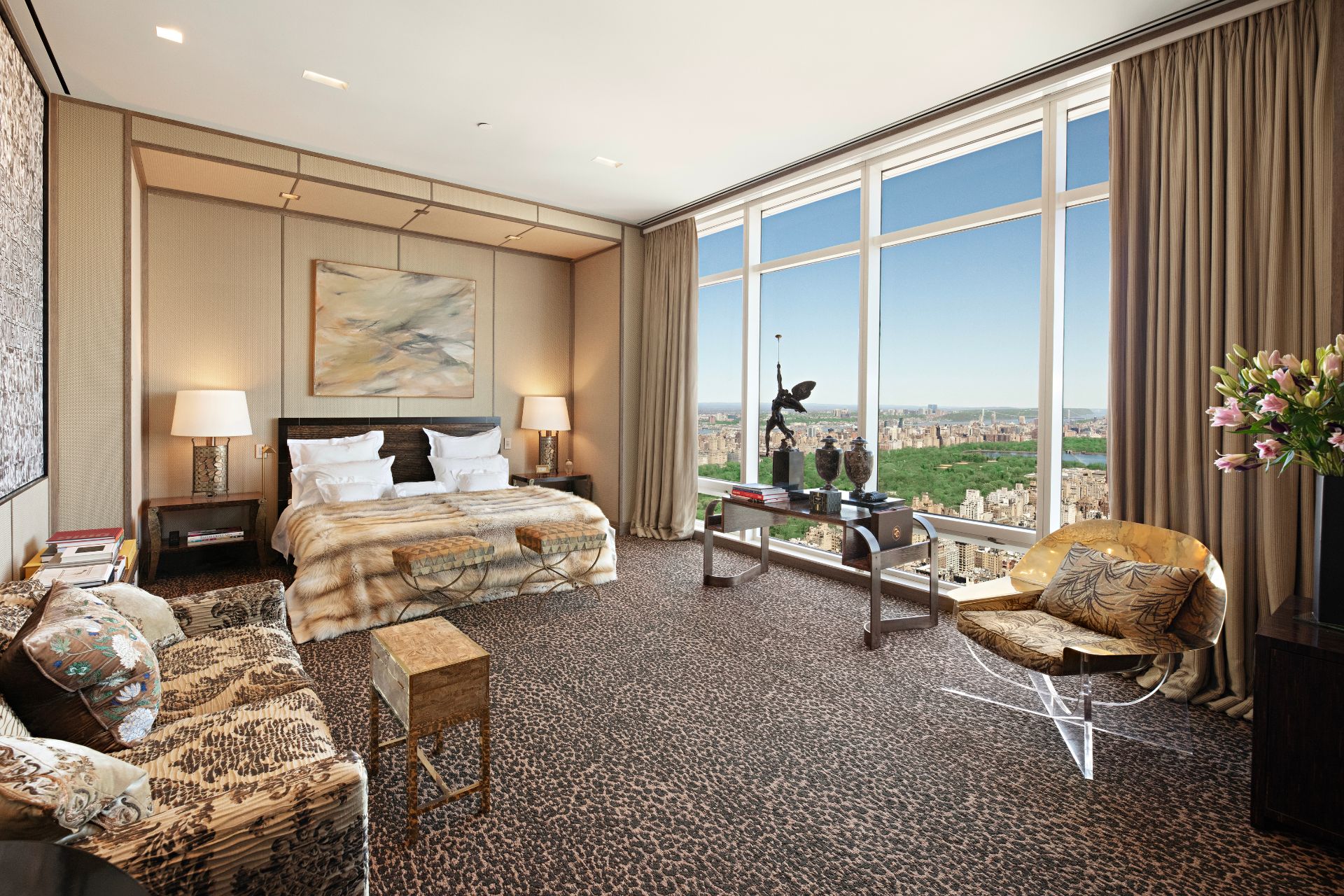 Bedroom with floor-to-ceiling windows and leopard print carpet