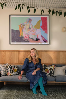 Kate Bryan on a sofa