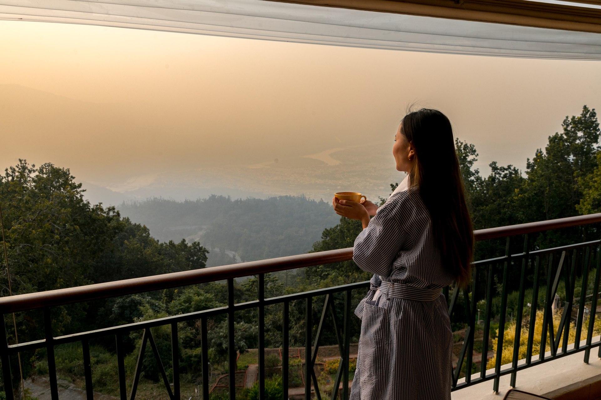 A woman overlooking the view from Ananda