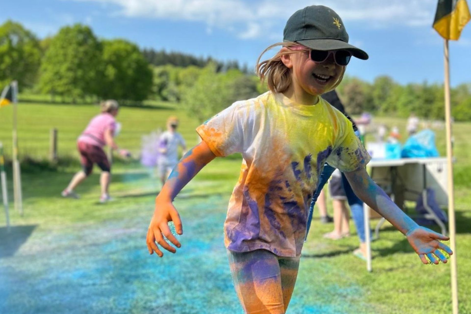 Young girl coloured in coloured powder