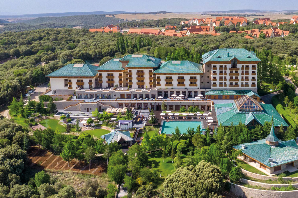 A hotel surrounded by greenery