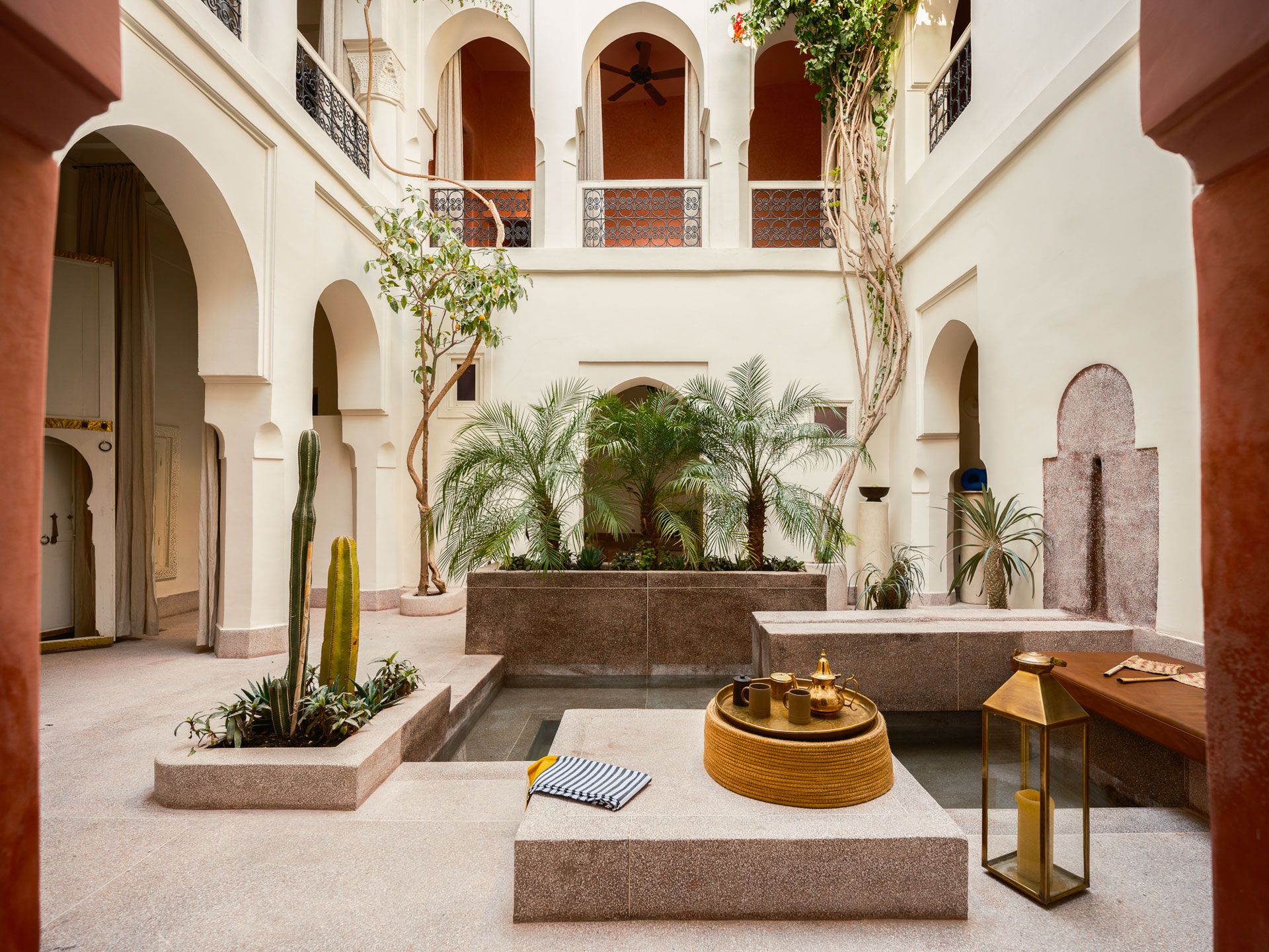 A traditional Marrakechi riad courtard at Riad Brummell, centring on a water feature