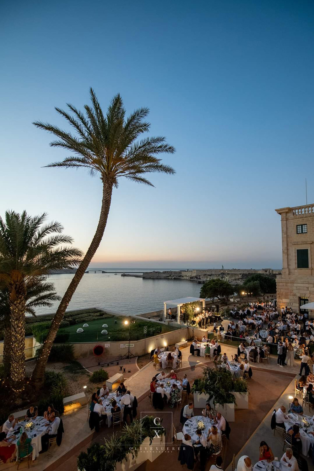 A coastal wedding venue at dusk