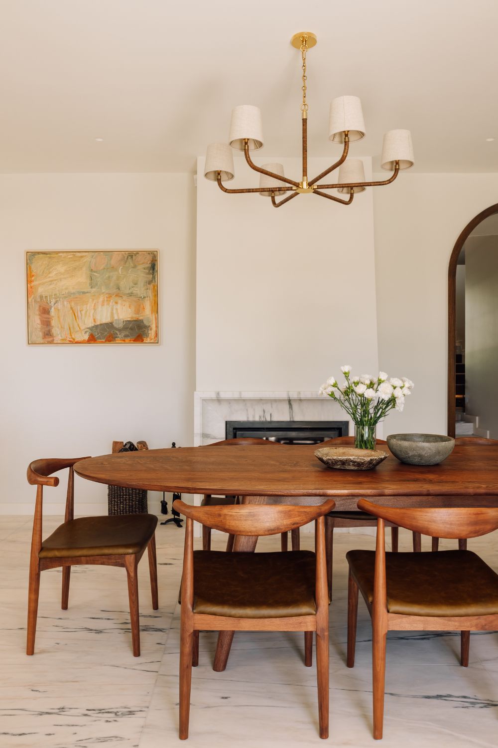 Dining area with white marble floor and bespoke oak dining table