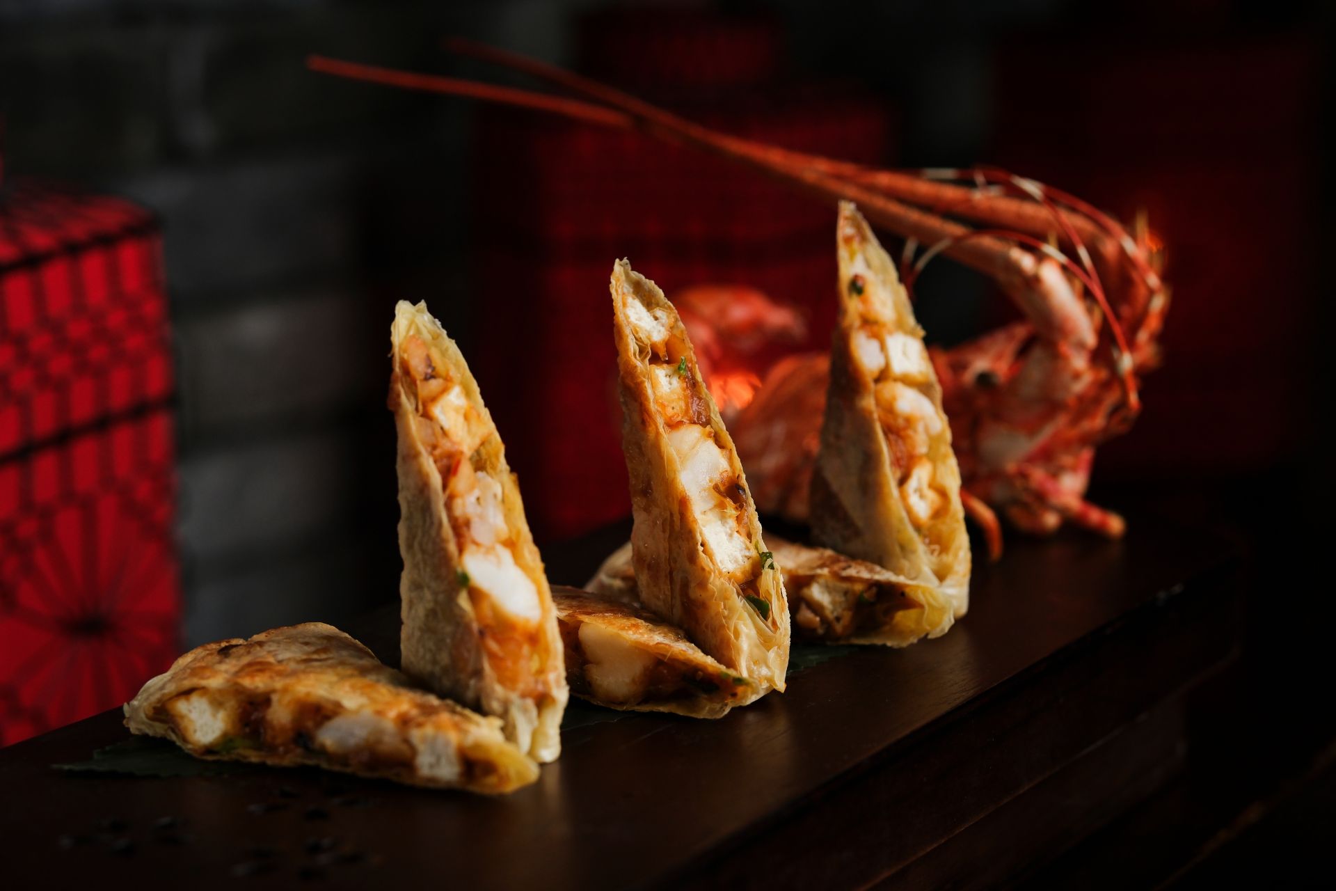 Lopster dumplings on a red plate