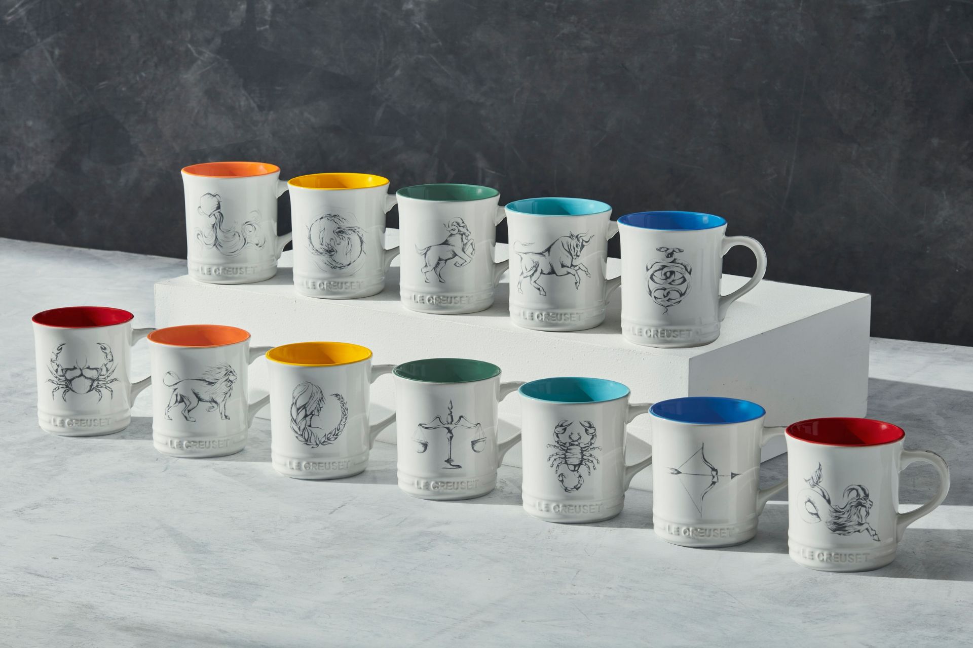 White Le Creuset mugs with colourful rims