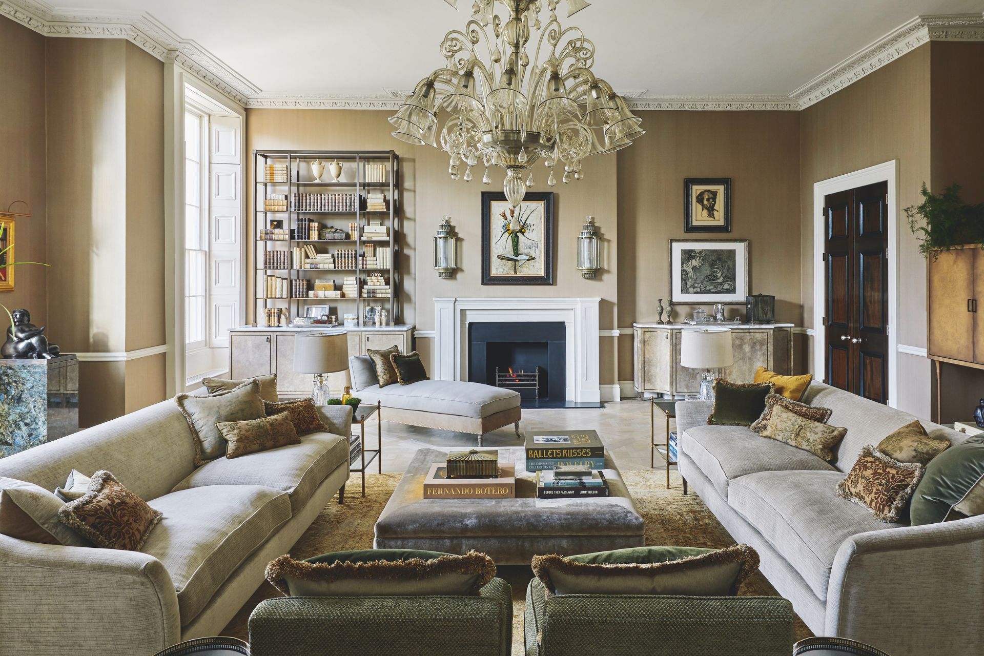 Living room in Grade II listed home with grey sofas and a crystal chandelier