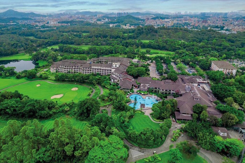 A hotel beside a golf course