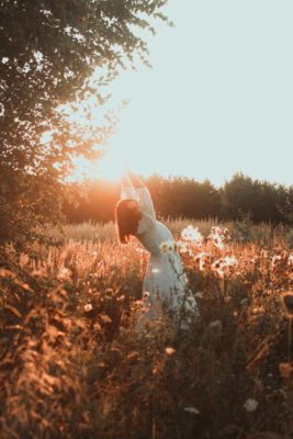 Woman dancing in a garden