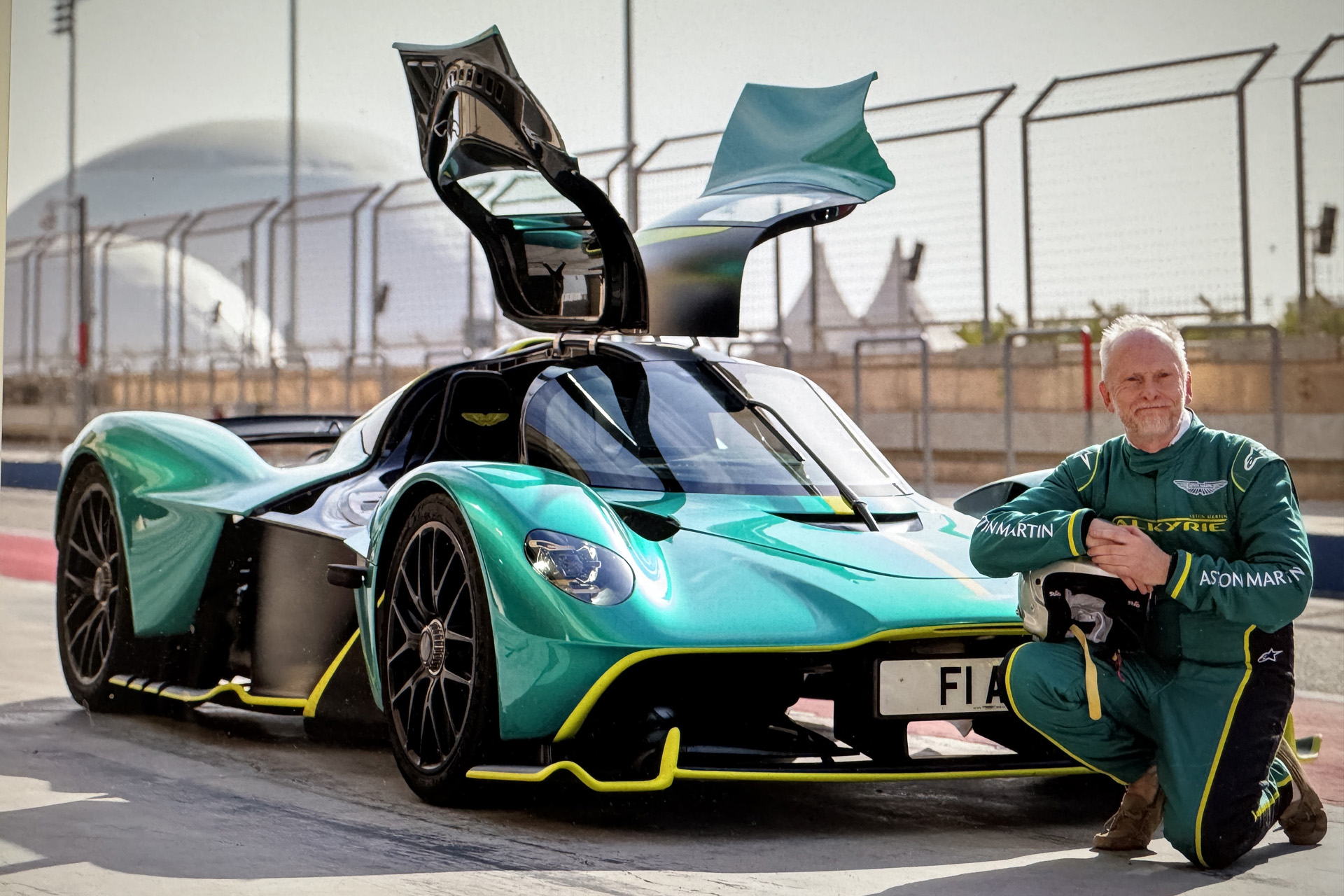 A man beside a supercar