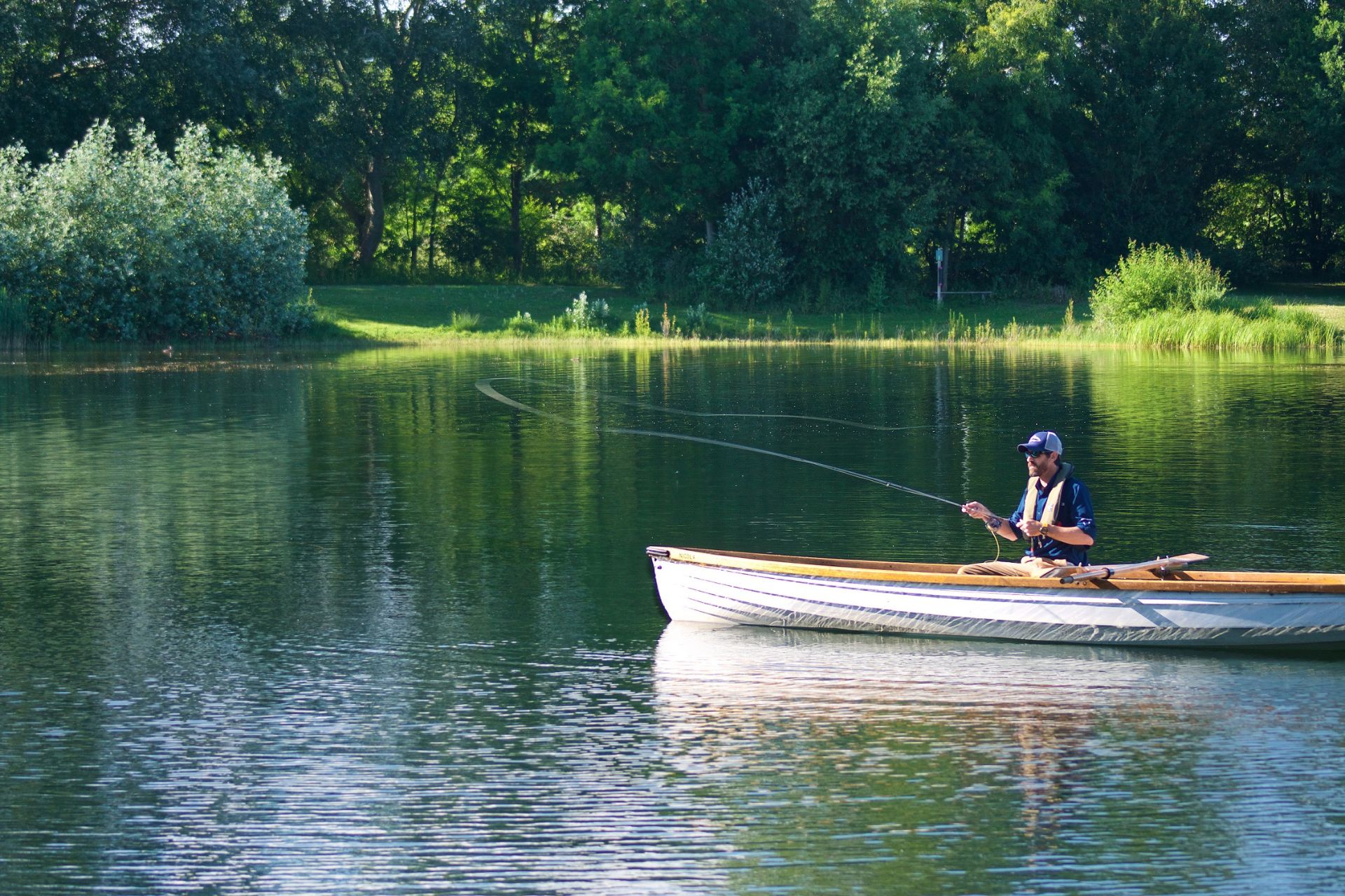 Man fly fishing on a lake