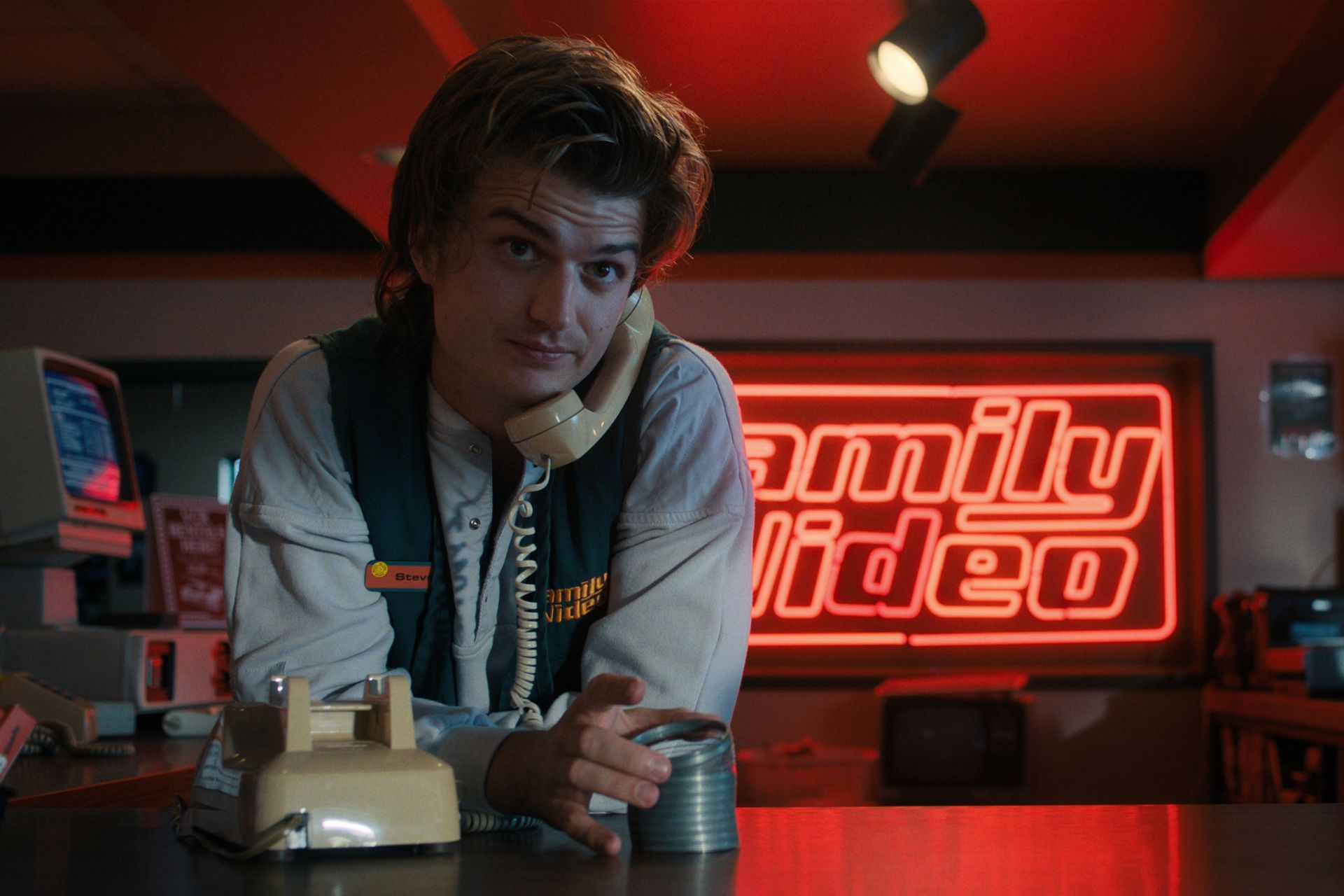 Joe Keery in a video store in Stranger Things