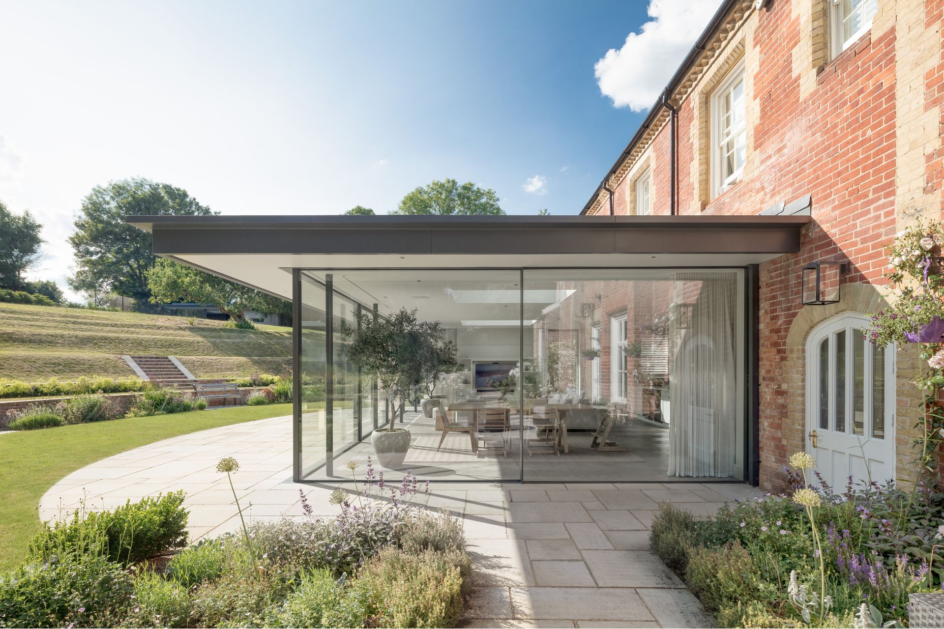 From Bistro Sets To Grecian Features, These Are 2025’s Biggest Garden Trends