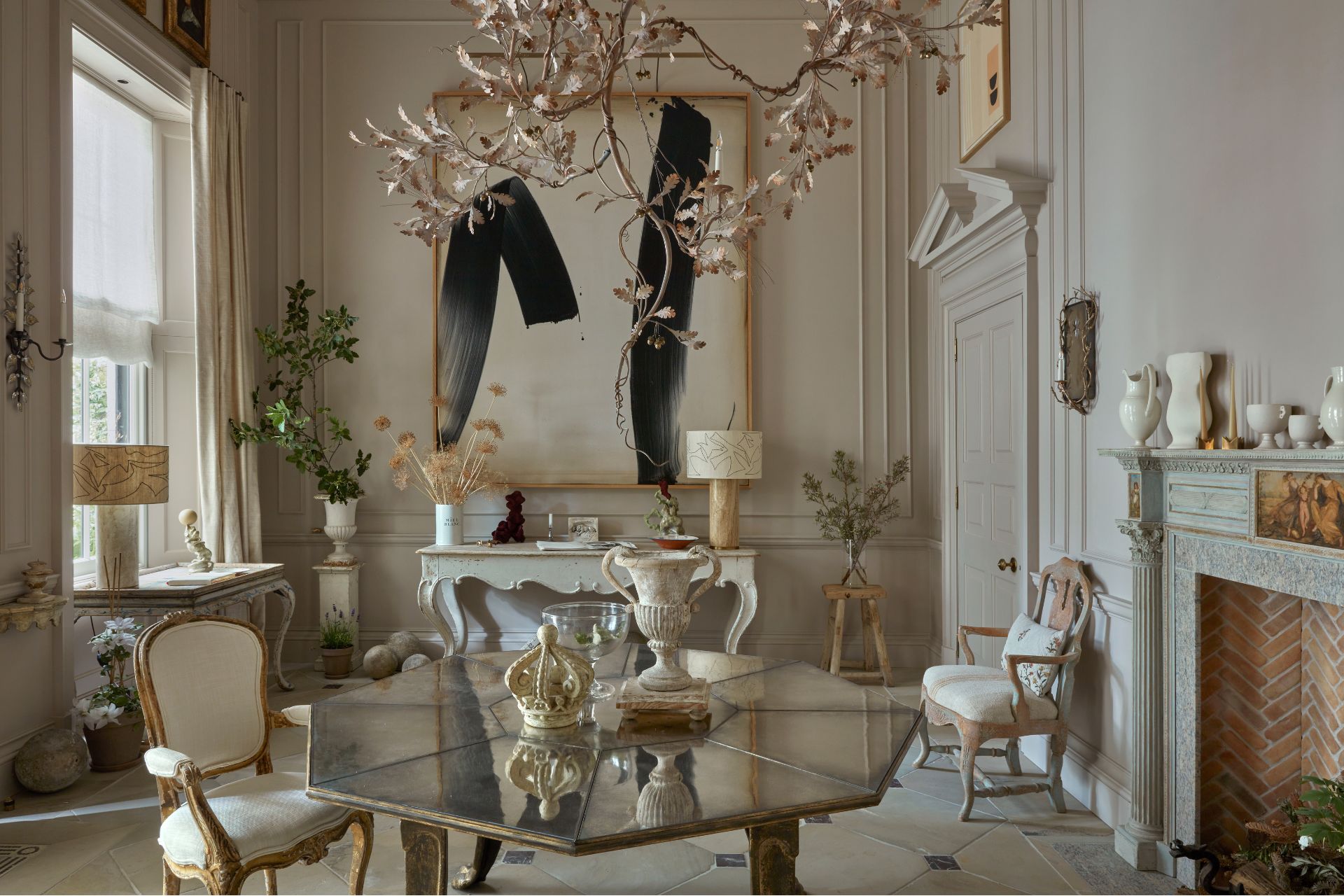 Hallway with petal chandelier, smoked glass table, and Georgian-style panelling