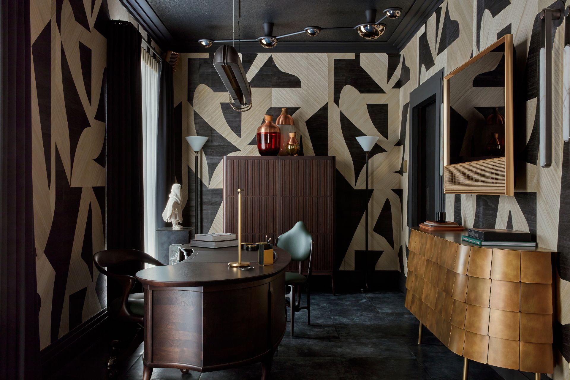 Study with black and white abstract patterned walls and dark walnut furniture