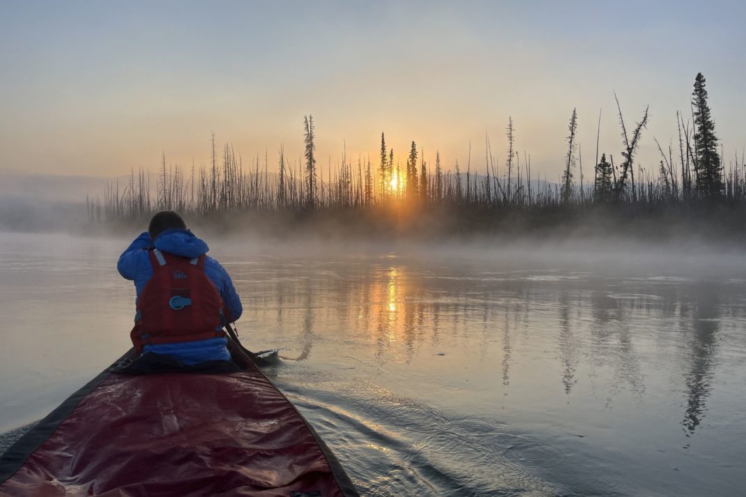 Canoe on a lake at sunrise