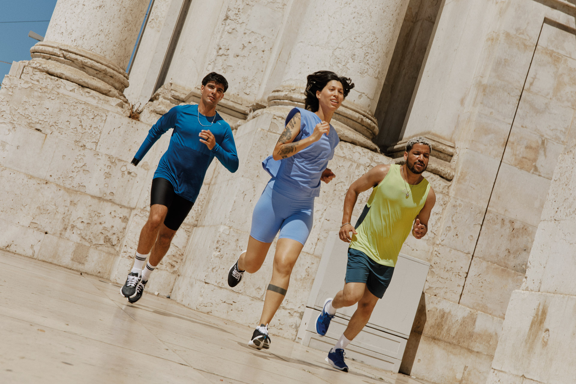 Three people running