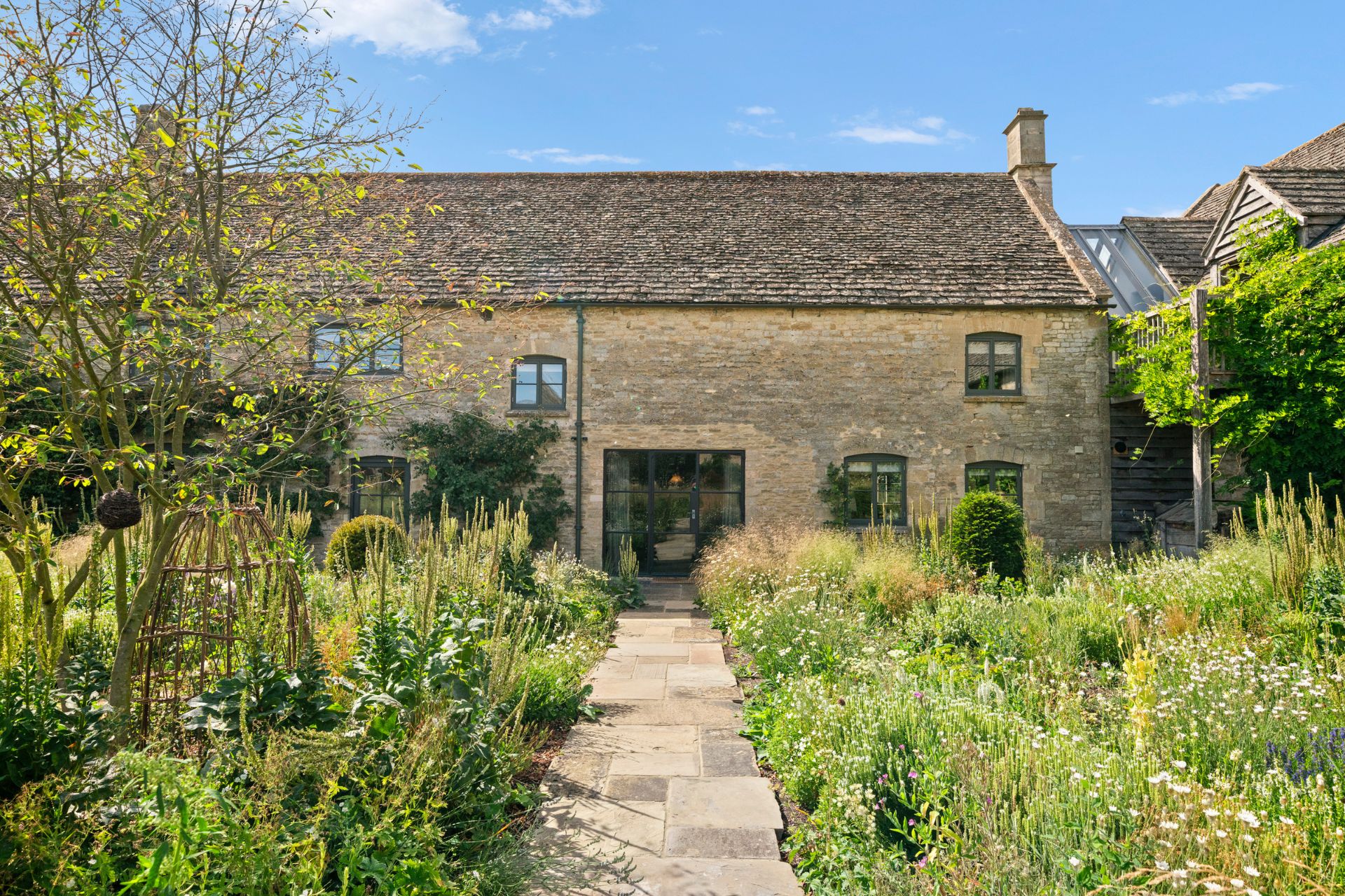 Ellen DeGeneres front of Cotswolds home