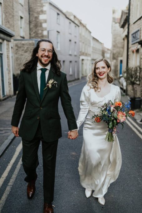 Couple on their wedding day, bride wearing Ashwell & Co