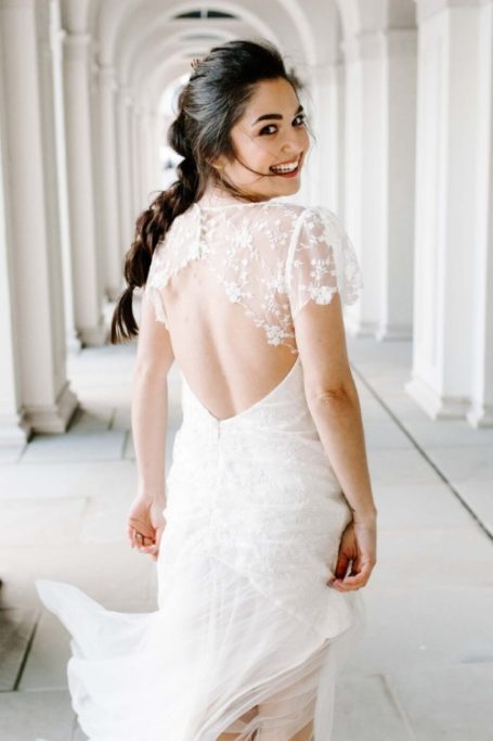 Woman wearing wedding dress from Bridal Reloved