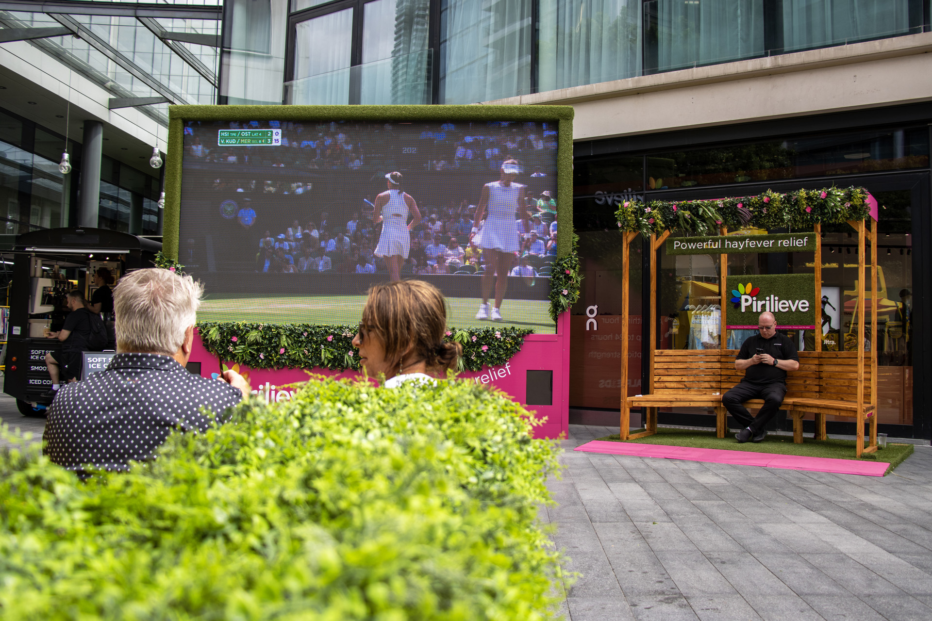 An outdoor screen broadcasting Wimbledon in Spitalfields