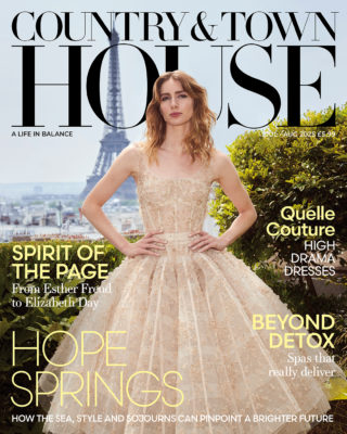 Model wearing couture gown with Paris in the background