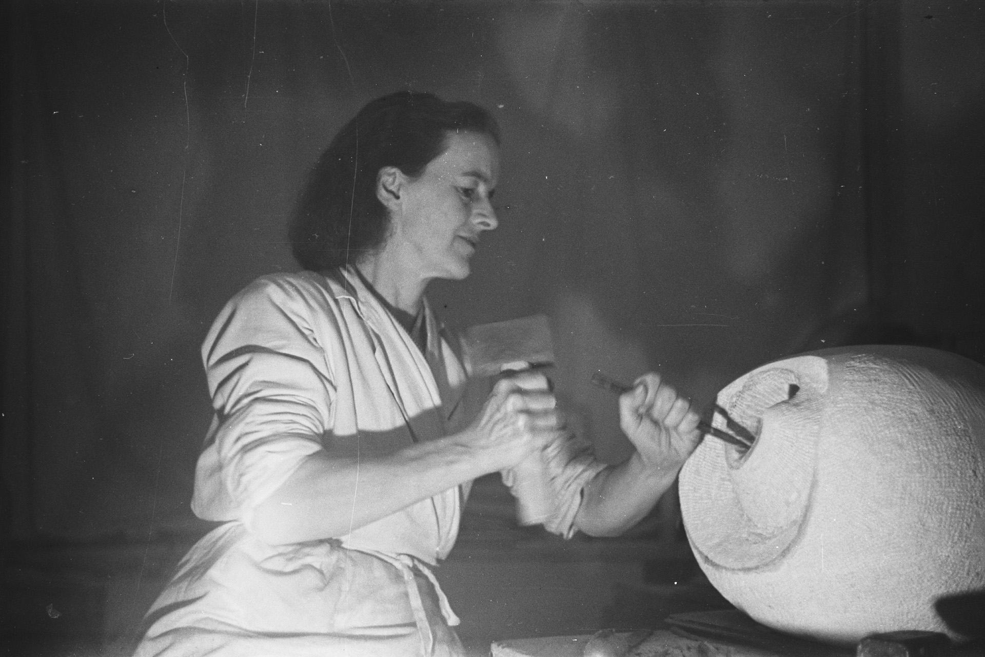 Barbara Hepworth carving a sculpture