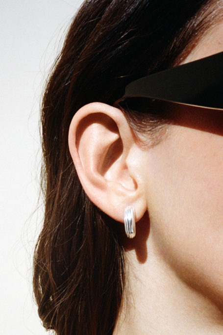 Close up of woman's face with silver earring