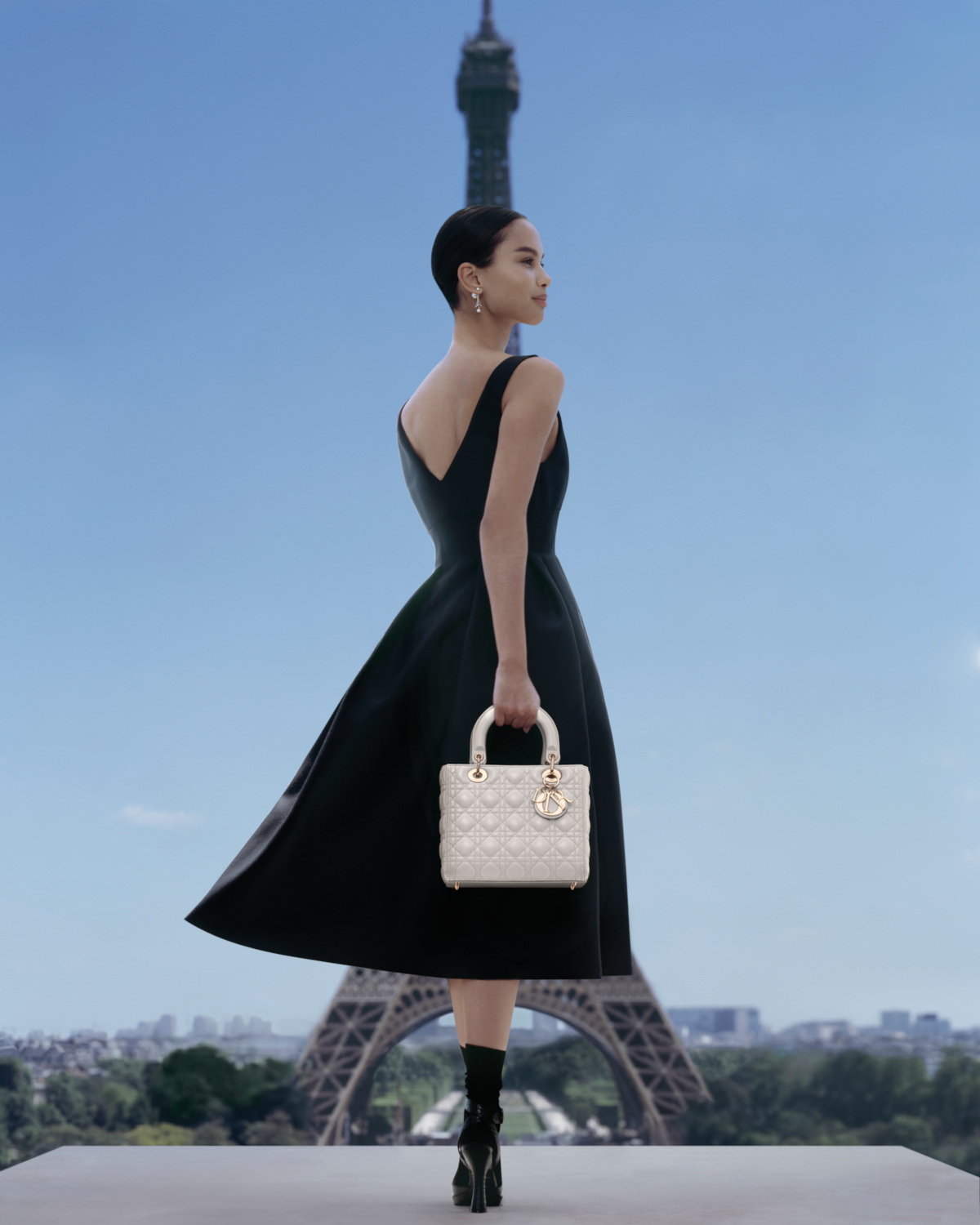 Woman holding Lady Dior bag in Paris