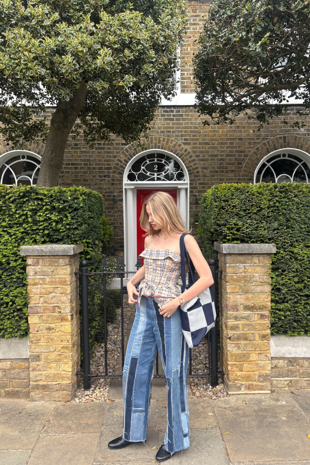 Woman wearing Loom x Oxfam bag