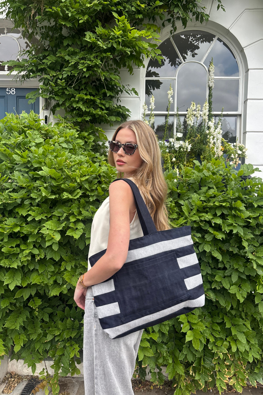 Woman wearing Loom x Oxfam bag