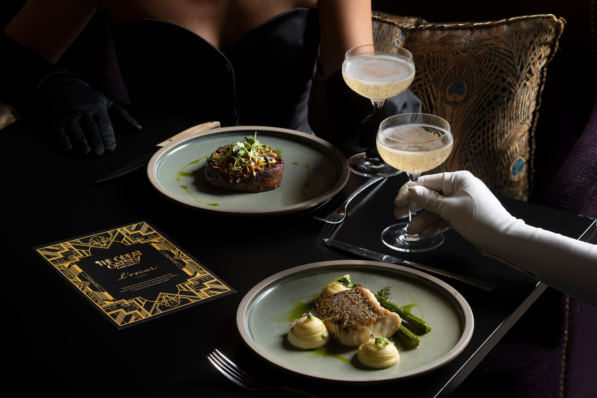 Two diners with plates and glasses