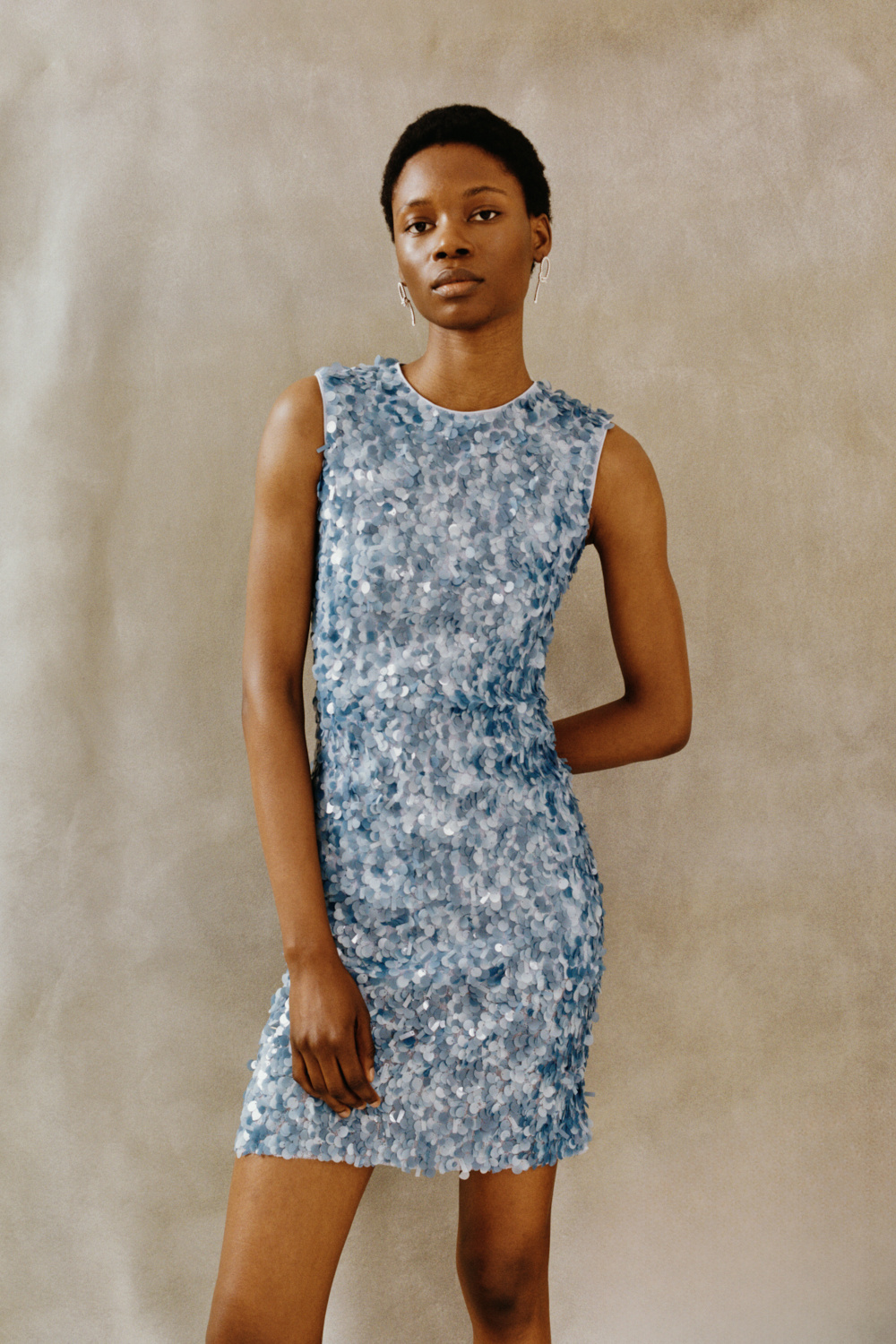 Woman in blue sequin dress