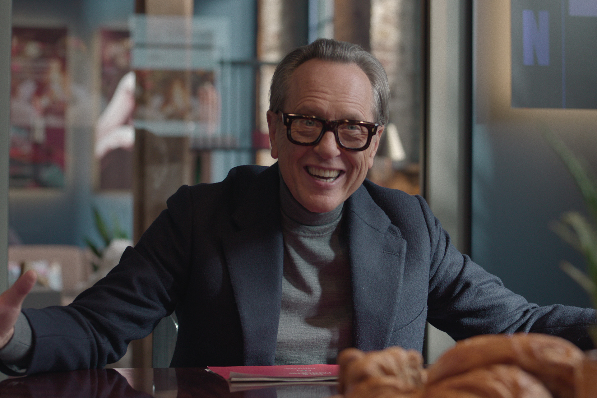 Richard E Grant as Jonno in Too Much