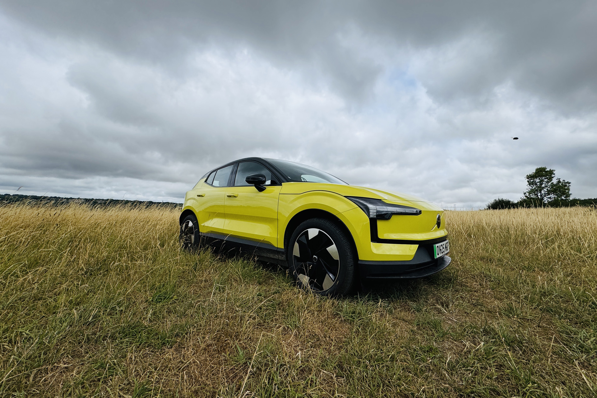 Yellow Volvo EX30 in a field
