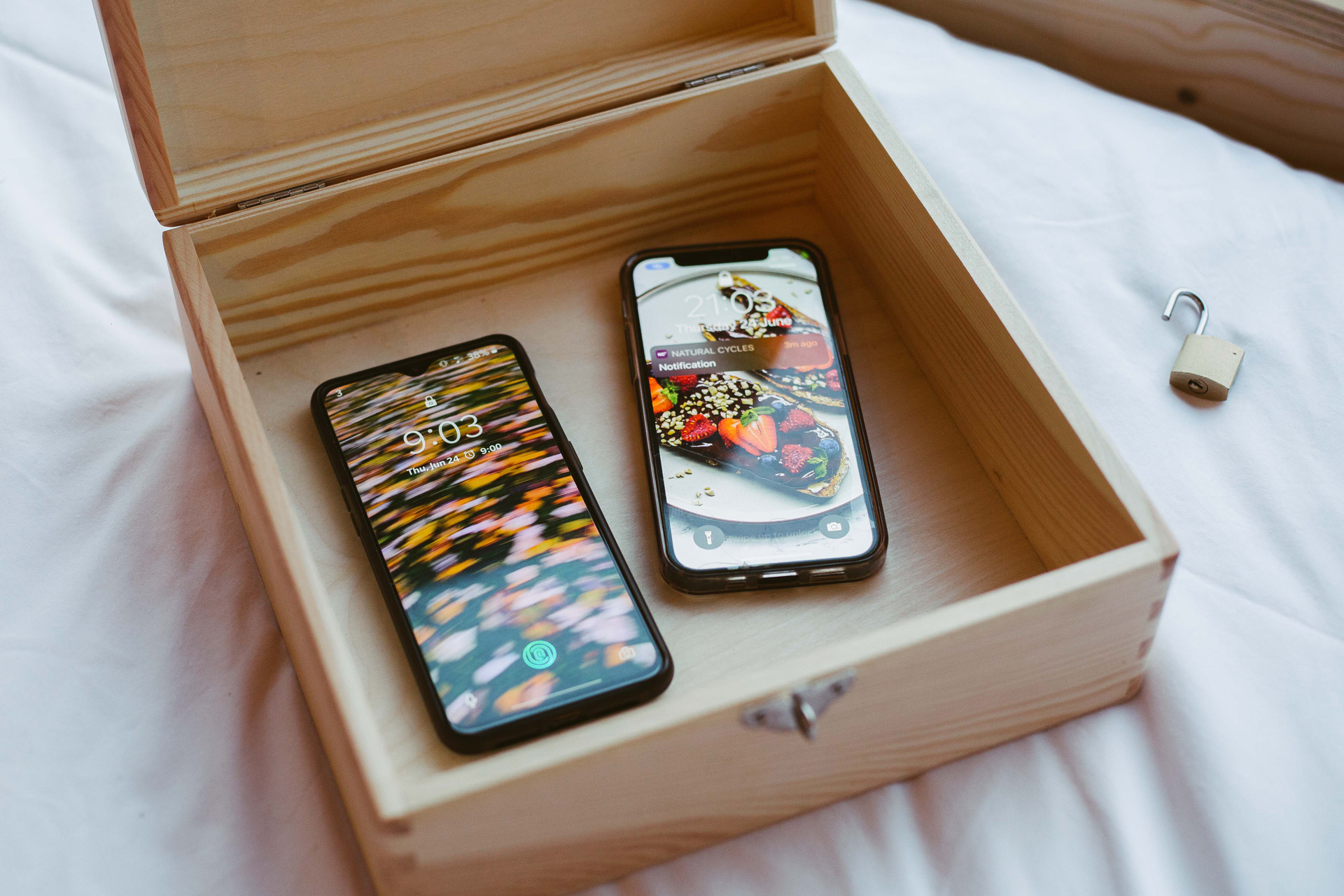 Two smarthphones in a lock box