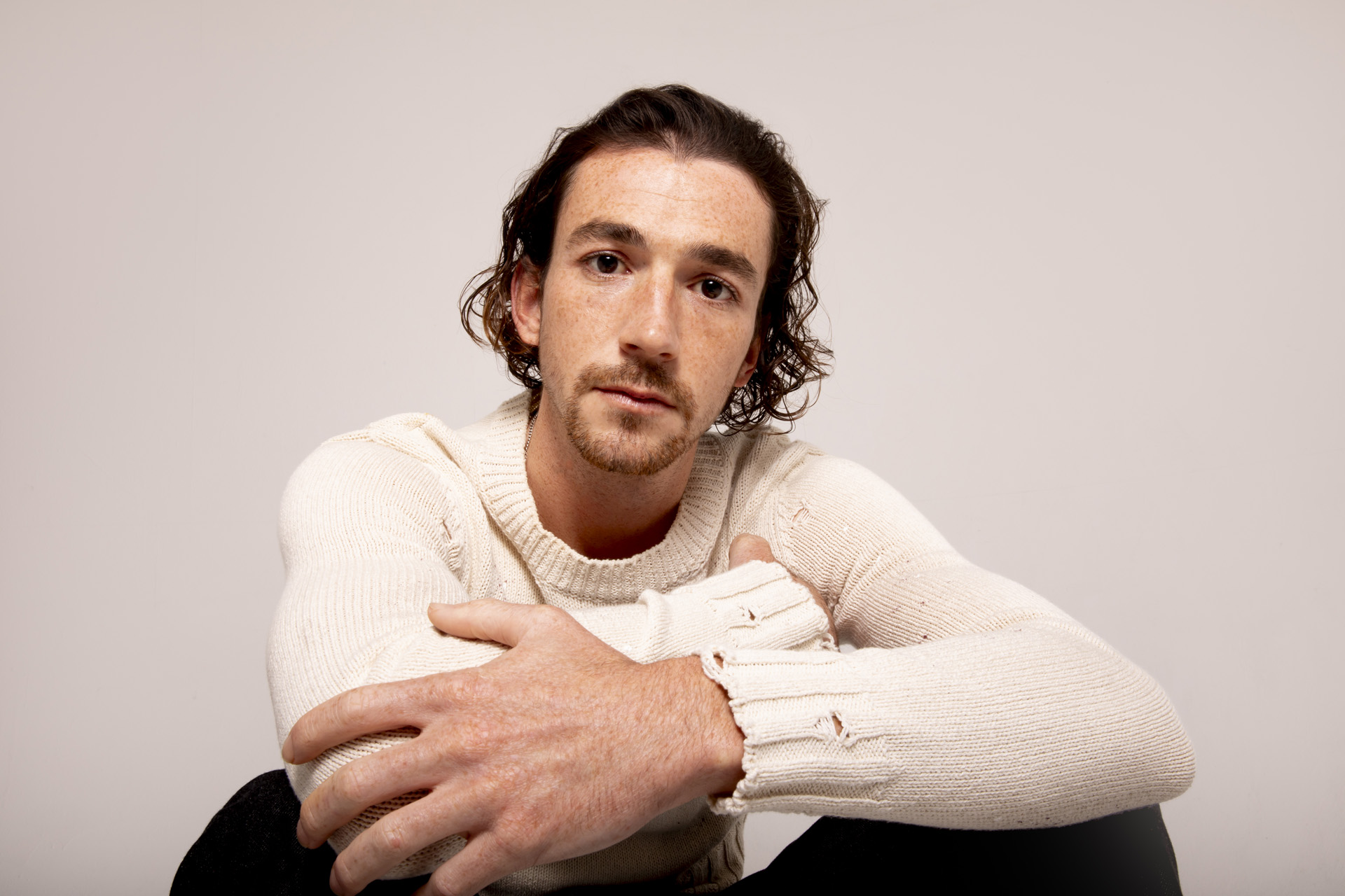 Rory Alexander in a white jumper