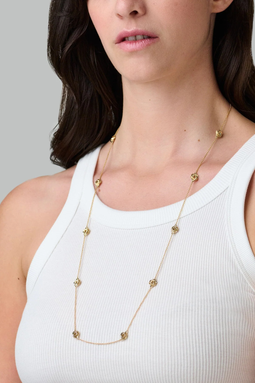 Woman wearing gold necklace