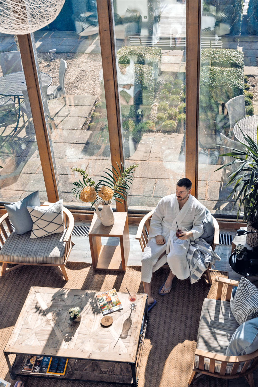 Man lounging in indoor seating area