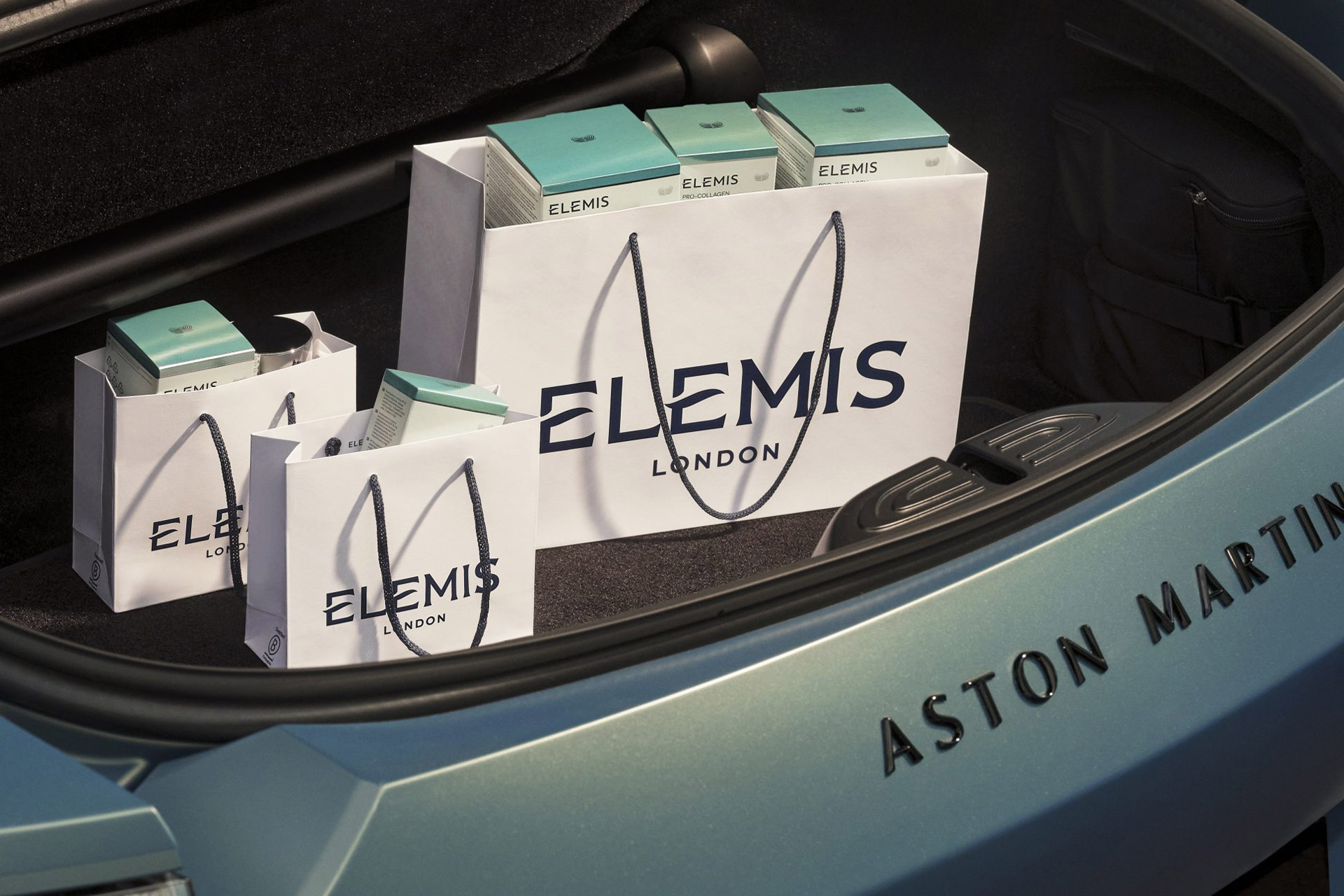 Elemis products in the boot of an Aston Martin car