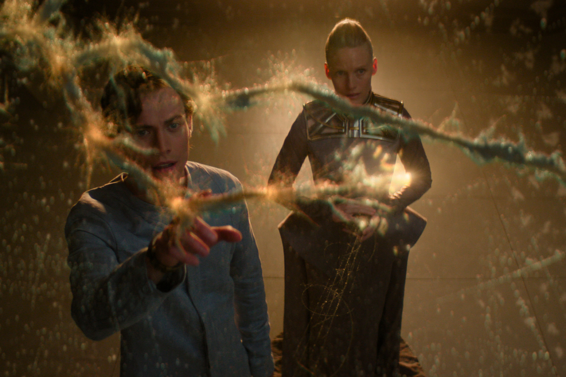 Cassian Bilton as Brother Dawn and Laura Birn as Demerzel in Foundation