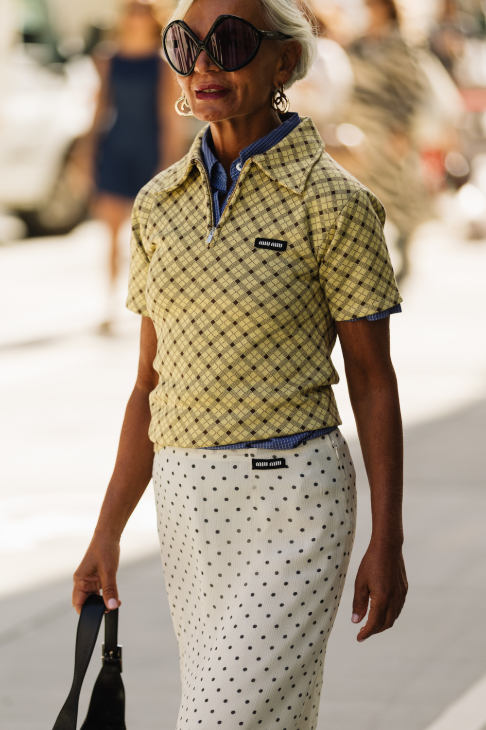 Woman wearing dotted skirt and diamond top | copenhagen street style