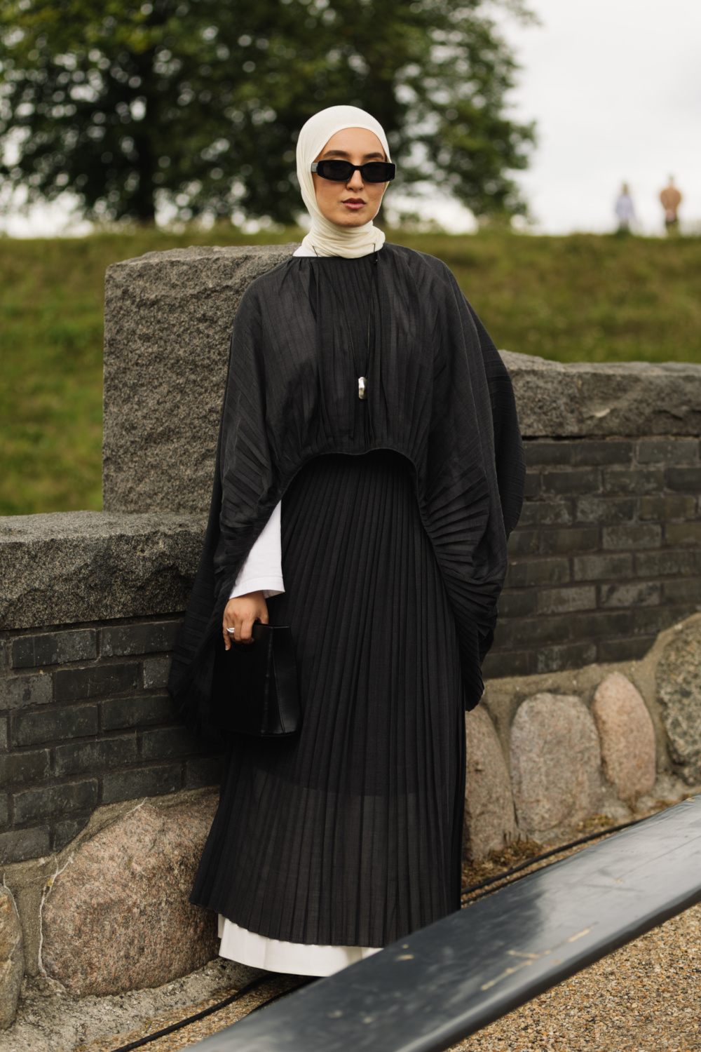 Woman in black and cream outfit | copenhagen street style