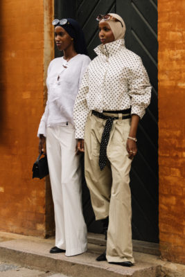 Two women stood in front of doorway