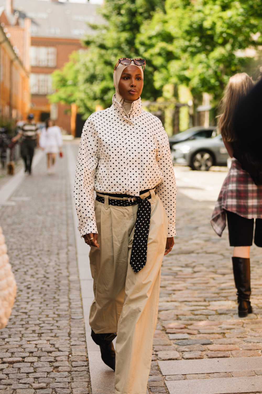 Woman wearing polka dot top | copenhagen street style