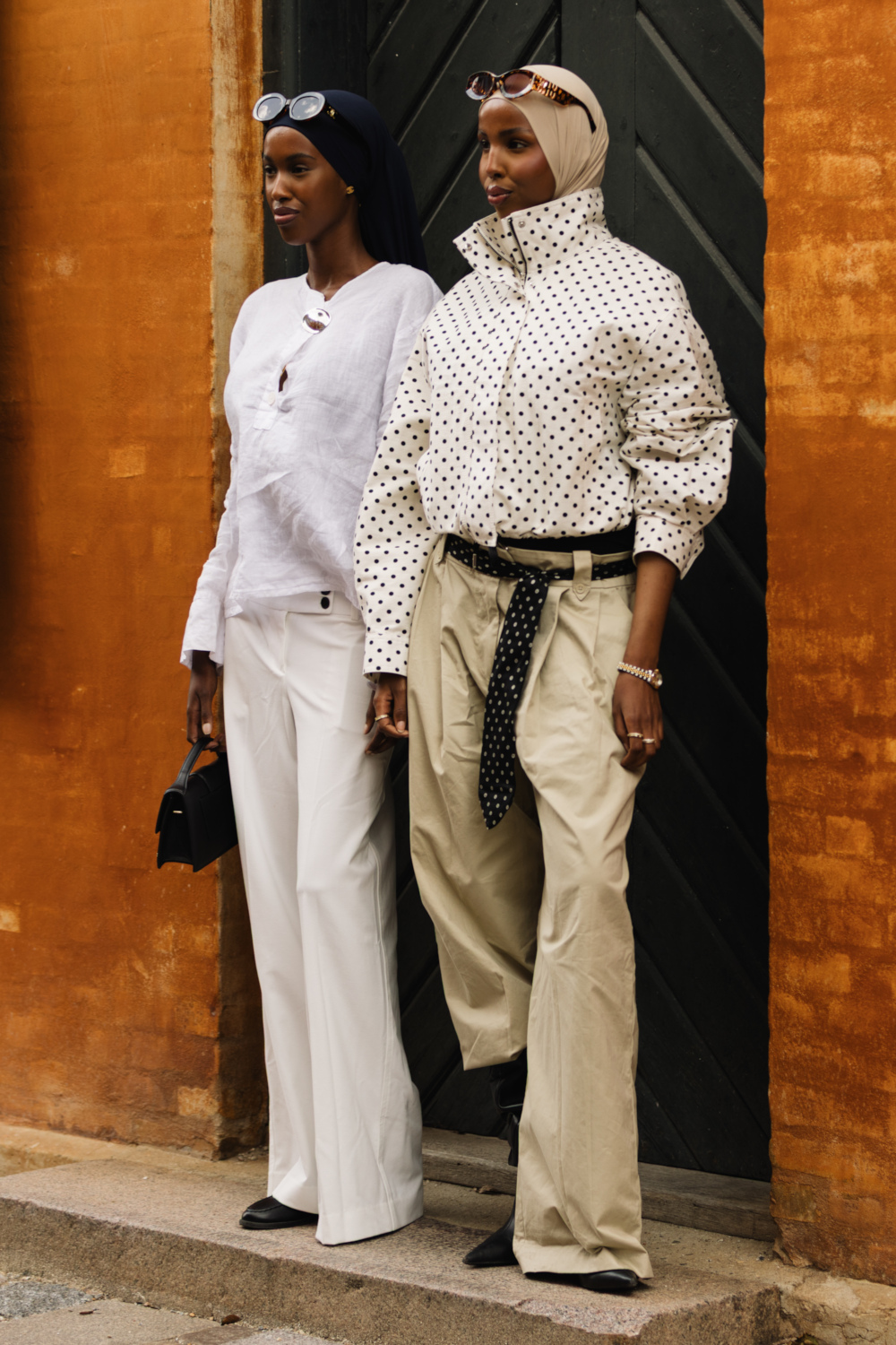 Two women stood in front of doorway