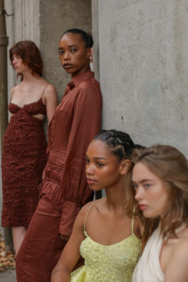 Models sat together against wall | Copenhagen Fashion Week SS26 Trends